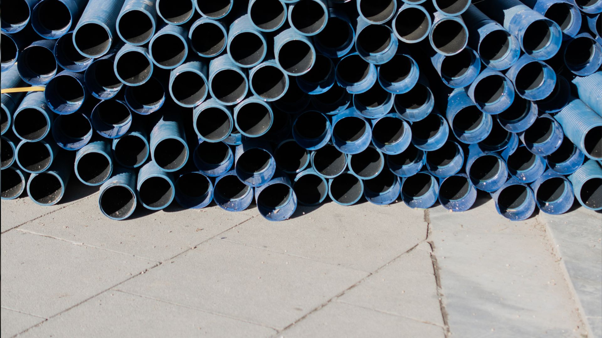 blue pipes stacked together