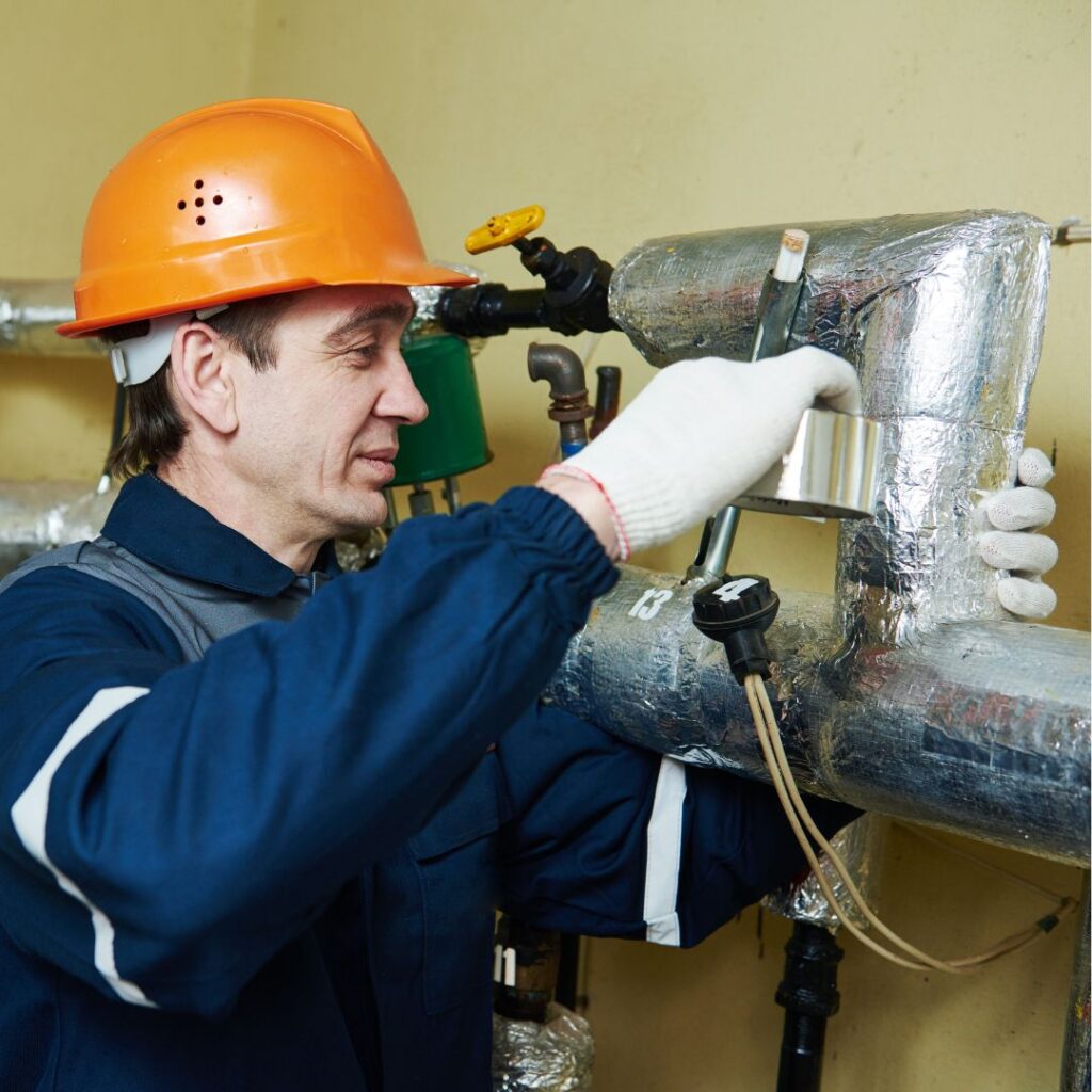 someone insulating pipes